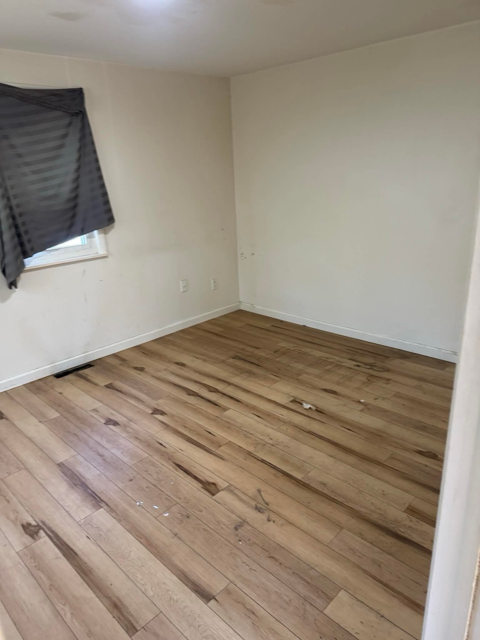 Same room cleared out and broom-clean after Haul Lotta Junk estate cleanout