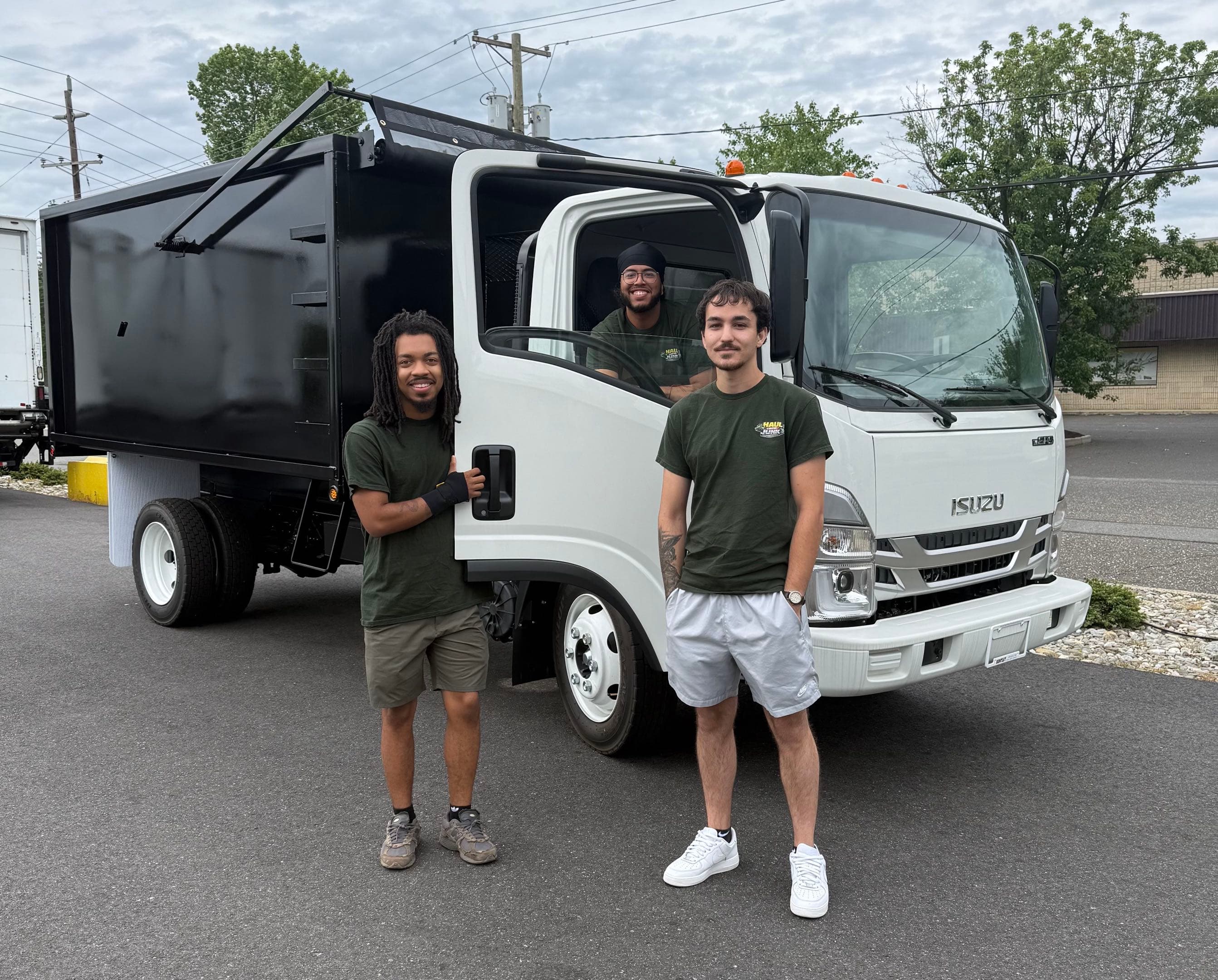 The Haul Lotta Junk crew with their 18 cubic yard dump truck
